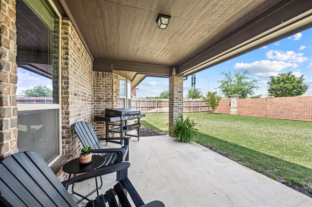 5209 Edgebrook Way Fort Worth, TX 76244 - Photo 5 of 33 a view of a porch with chairs and backyard