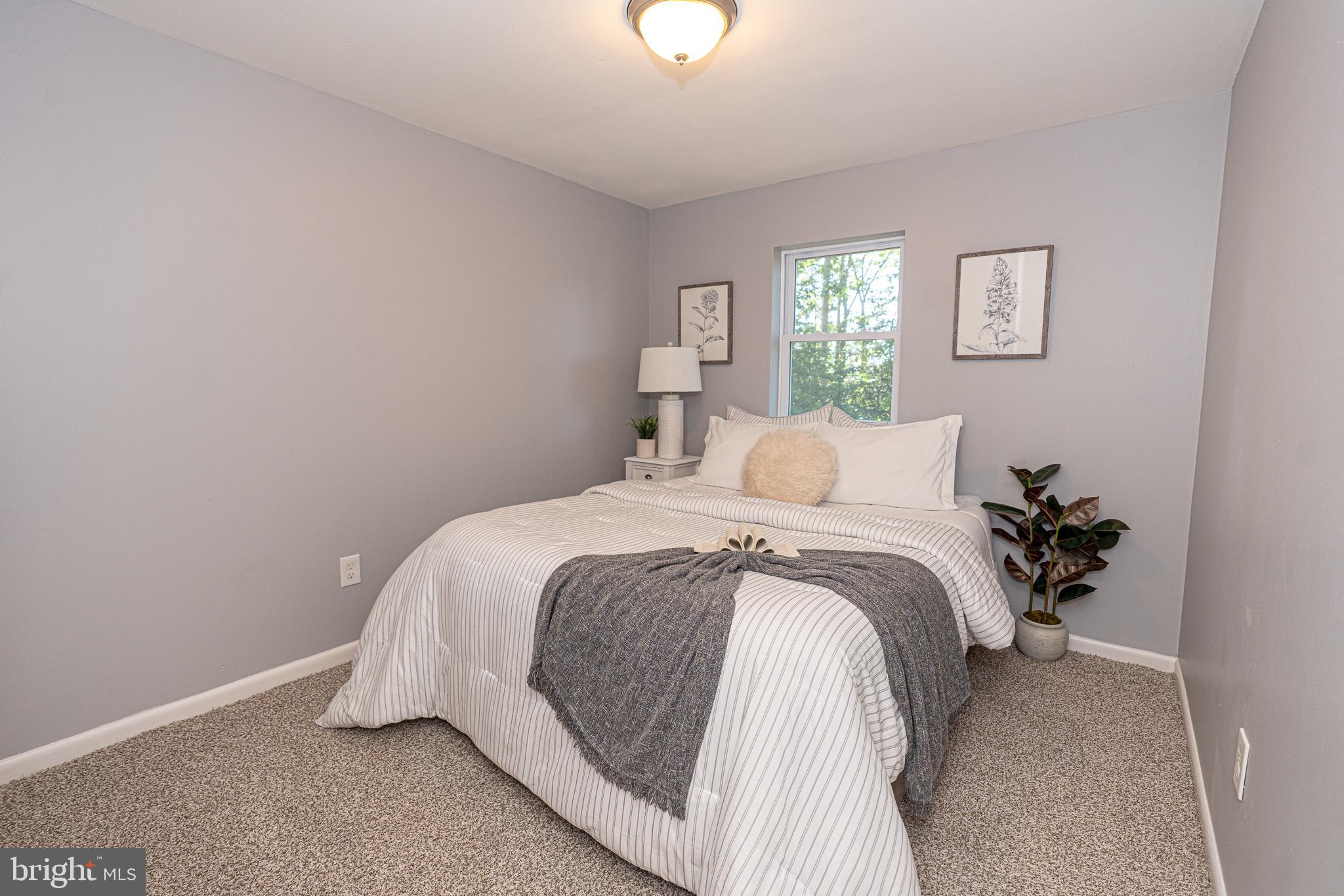 514 Holly Hunt Road Middle River, MD 21220 - Photo 20 of 32 a bedroom with a bed and a window