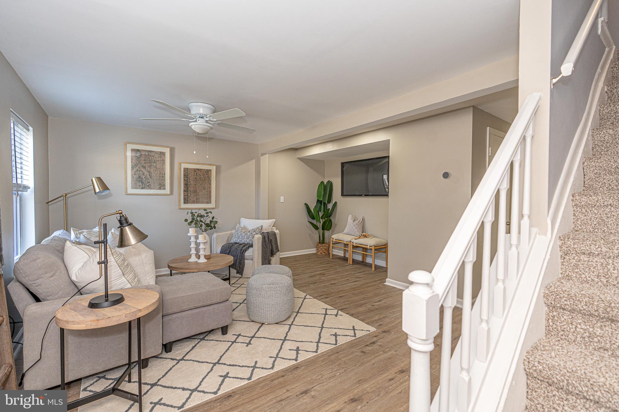 514 Holly Hunt Road Middle River, MD 21220 - Photo 2 of 32 a living room with furniture and wooden floor