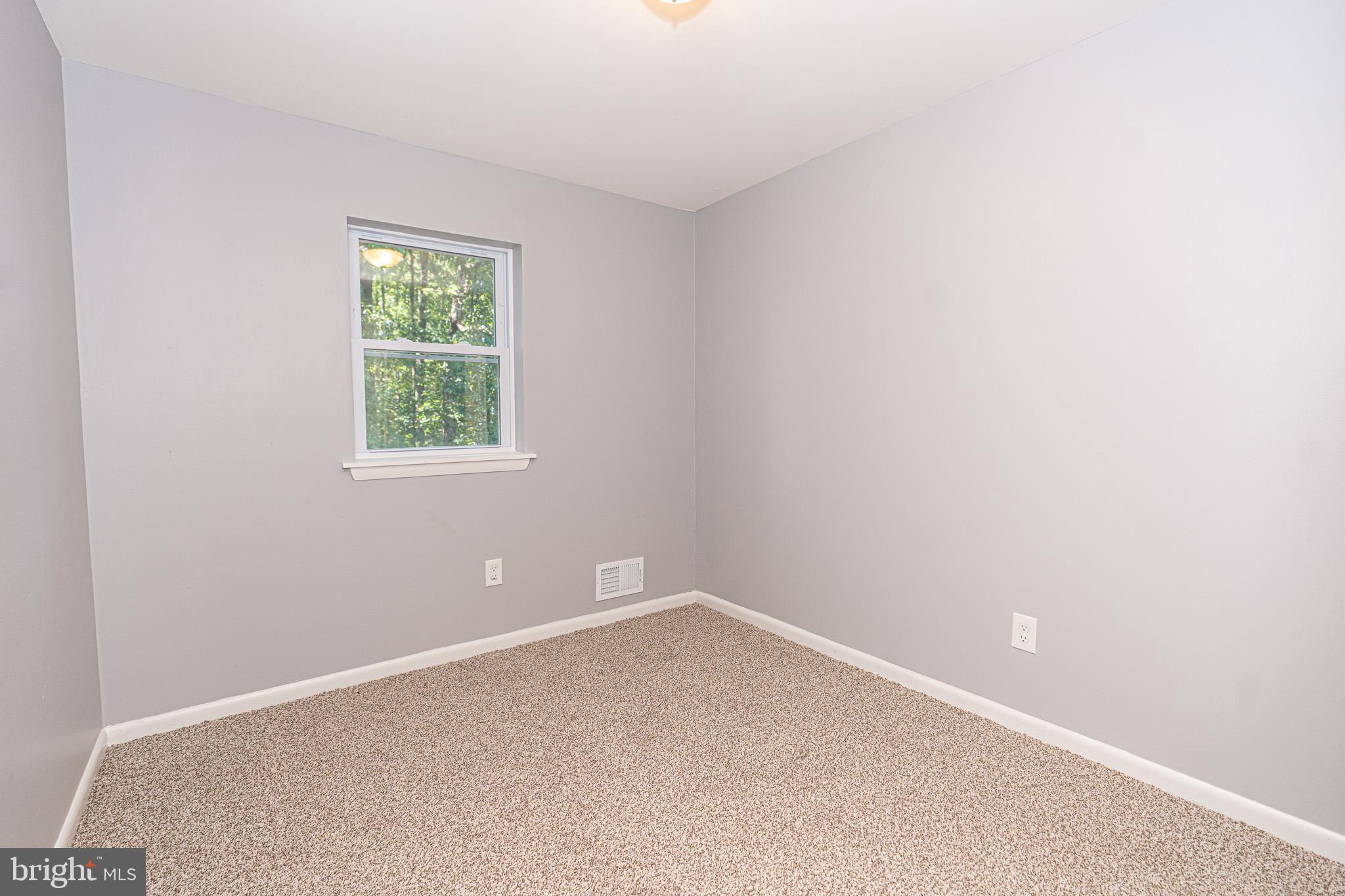 514 Holly Hunt Road Middle River, MD 21220 - Photo 21 of 32 an empty room with a window