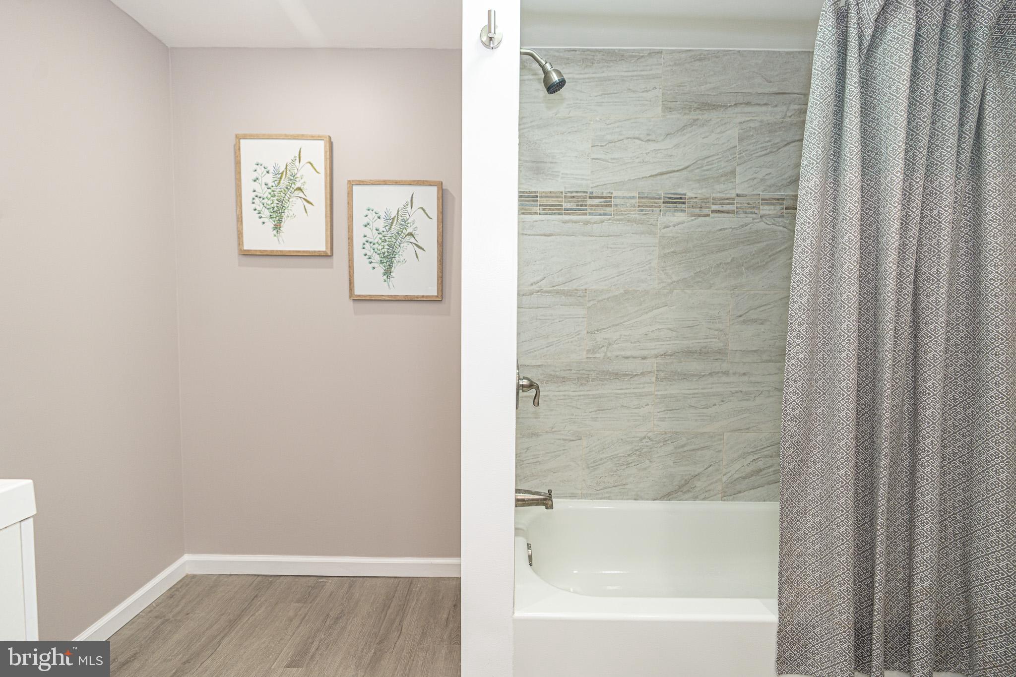 514 Holly Hunt Road Middle River, MD 21220 - Photo 23 of 32 a bathroom with a bathtub