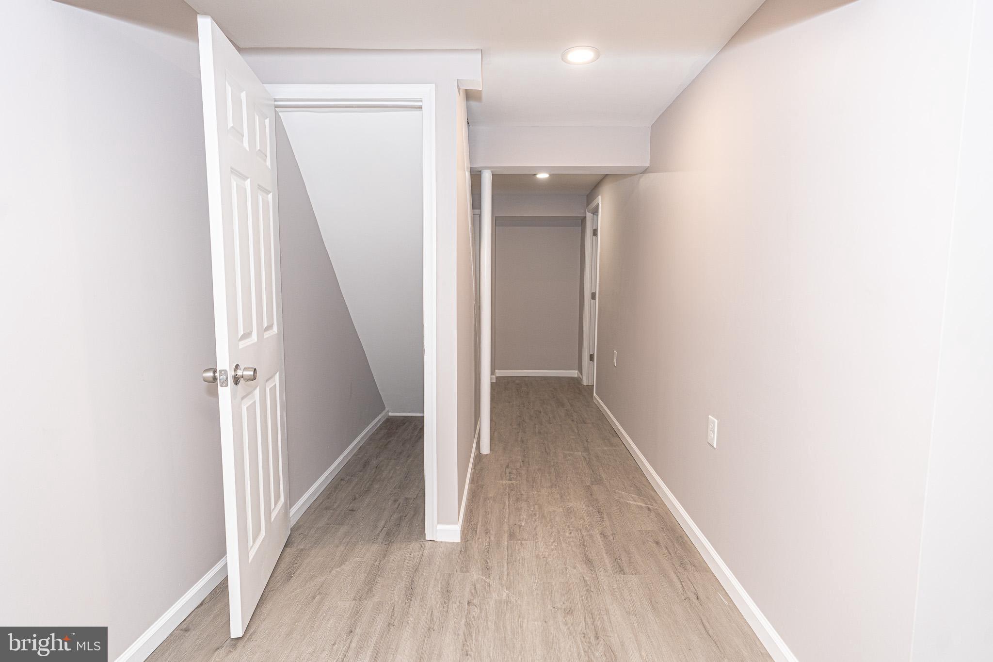 514 Holly Hunt Road Middle River, MD 21220 - Photo 25 of 32 a view of a hallway with wooden floor