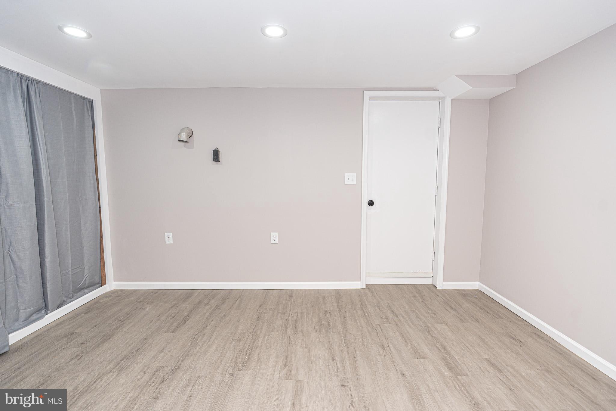 514 Holly Hunt Road Middle River, MD 21220 - Photo 27 of 32 a view of an empty room with wooden floor