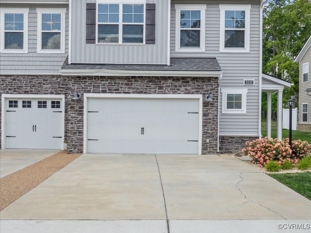 3232 Gannet Lane Midlothian, VA 23112 - Photo 11 of 48 a front view of a house with a garden