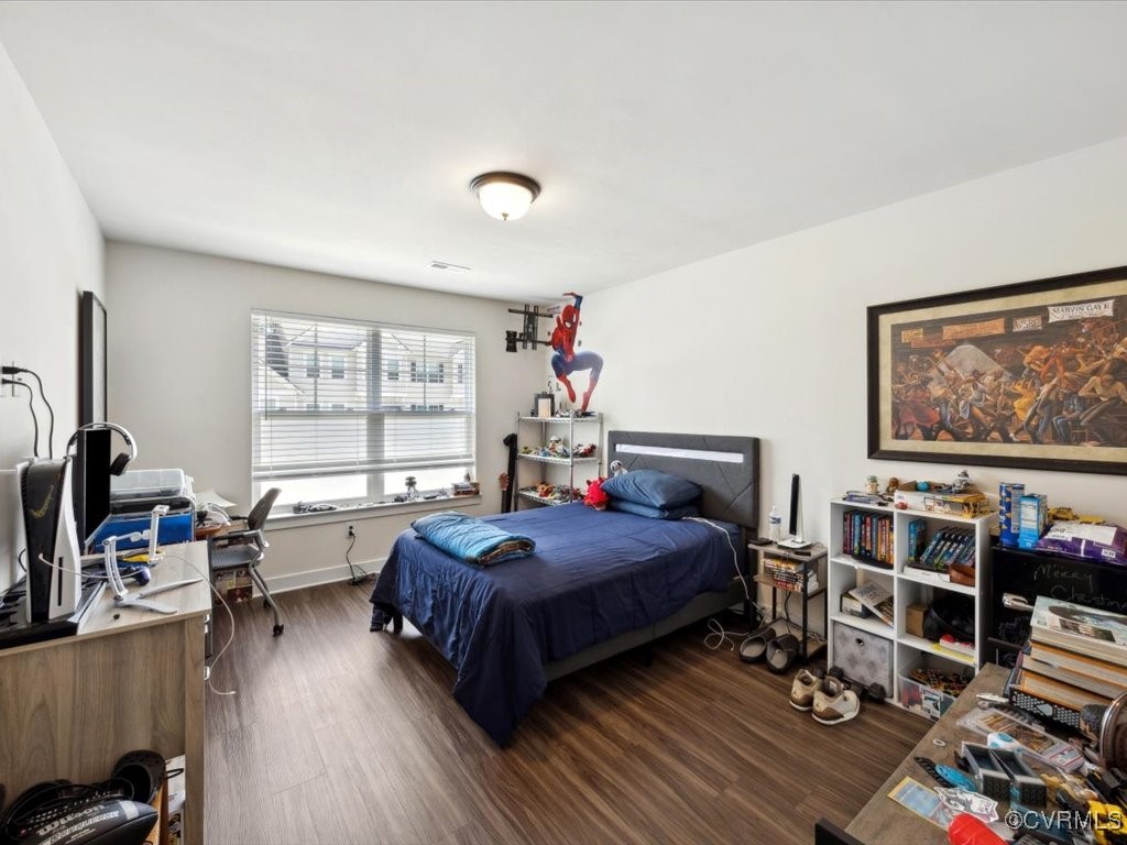 3232 Gannet Lane Midlothian, VA 23112 - Photo 27 of 48 a bedroom with bed and a bookshelf