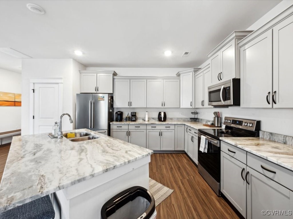 3232 Gannet Lane Midlothian, VA 23112 - Photo 3 of 48 a kitchen with stainless steel appliances kitchen island granite countertop a stove refrigerator and cabinets