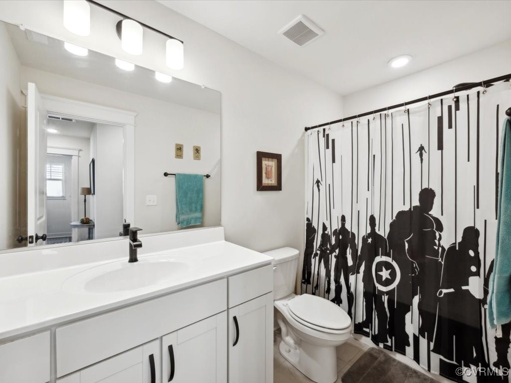 3232 Gannet Lane Midlothian, VA 23112 - Photo 33 of 48 a bathroom with a toilet sink and mirror