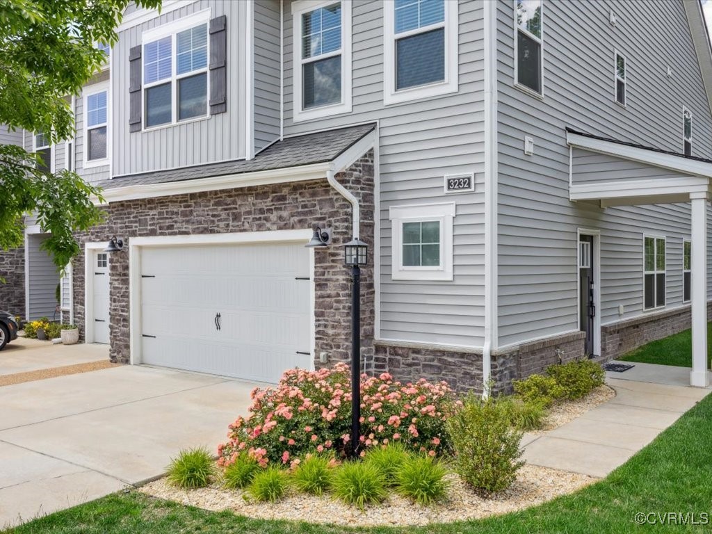 3232 Gannet Lane Midlothian, VA 23112 - Photo 36 of 48 a front view of a house with a garden
