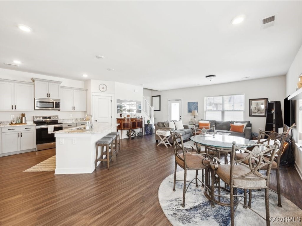 3232 Gannet Lane Midlothian, VA 23112 - Photo 4 of 48 a living room with lots of furniture and kitchen view