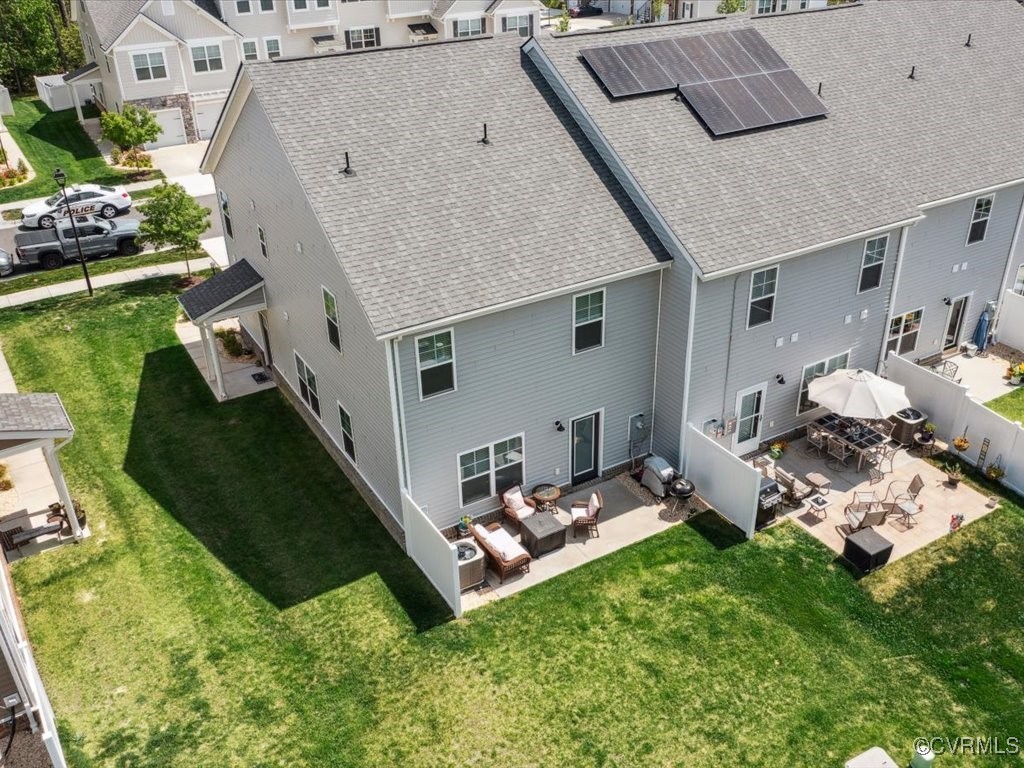 3232 Gannet Lane Midlothian, VA 23112 - Photo 43 of 48 a backyard of a house with table and chairs