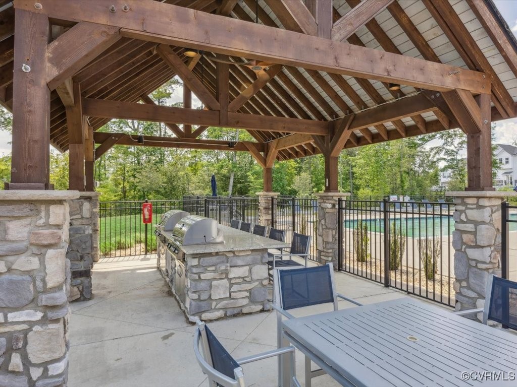 3232 Gannet Lane Midlothian, VA 23112 - Photo 48 of 48 a patio with water view fountain with wooden floor and fence