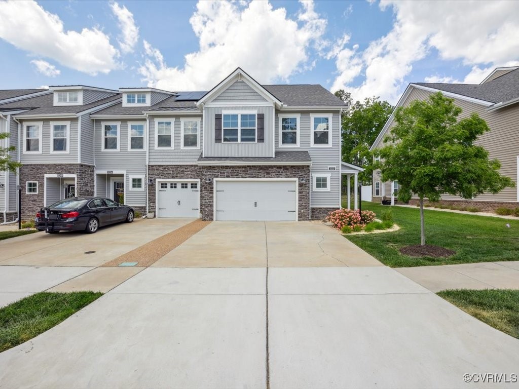 3232 Gannet Lane Midlothian, VA 23112 - Photo 10 of 48 a front view of a house with a yard and garage