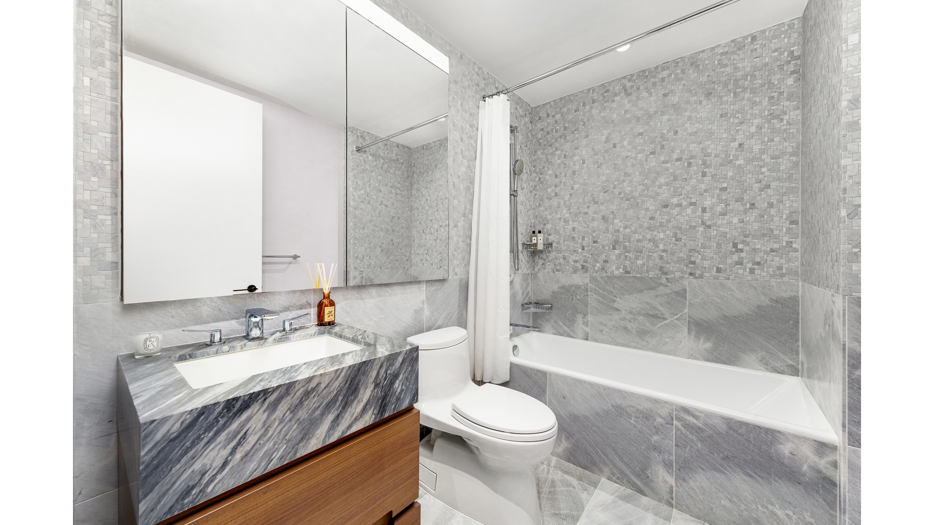 30 Riverside Boulevard, Unit 36B Manhattan, NY 10069 - Photo 10 of 27 a bathroom with a sink a toilet and shower