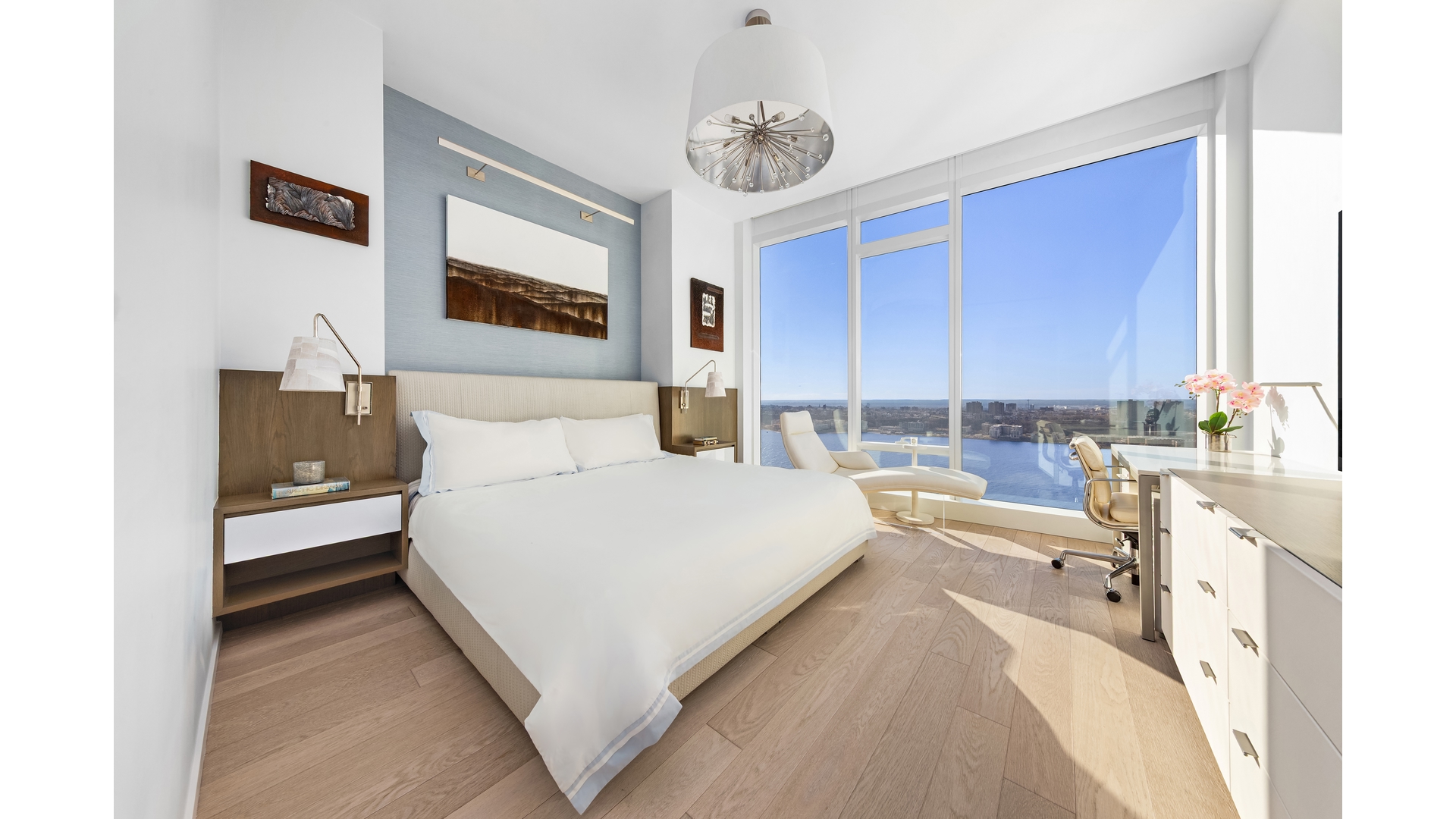 30 Riverside Boulevard, Unit 36B Manhattan, NY 10069 - Photo 5 of 27 a bed room with a bed and a couch