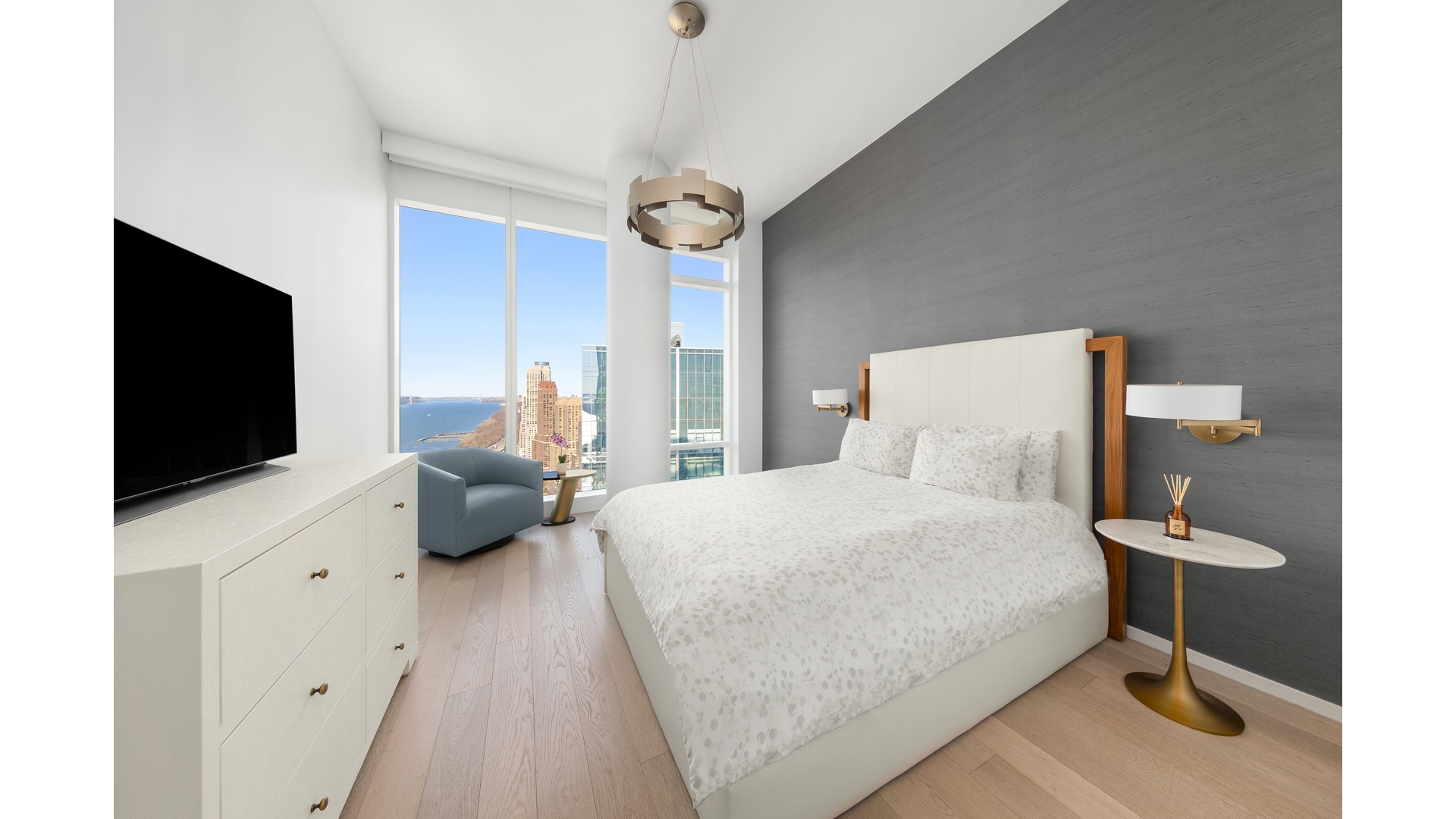 30 Riverside Boulevard, Unit 36B Manhattan, NY 10069 - Photo 7 of 27 a bedroom with a bed and a flat tv screen on dresser