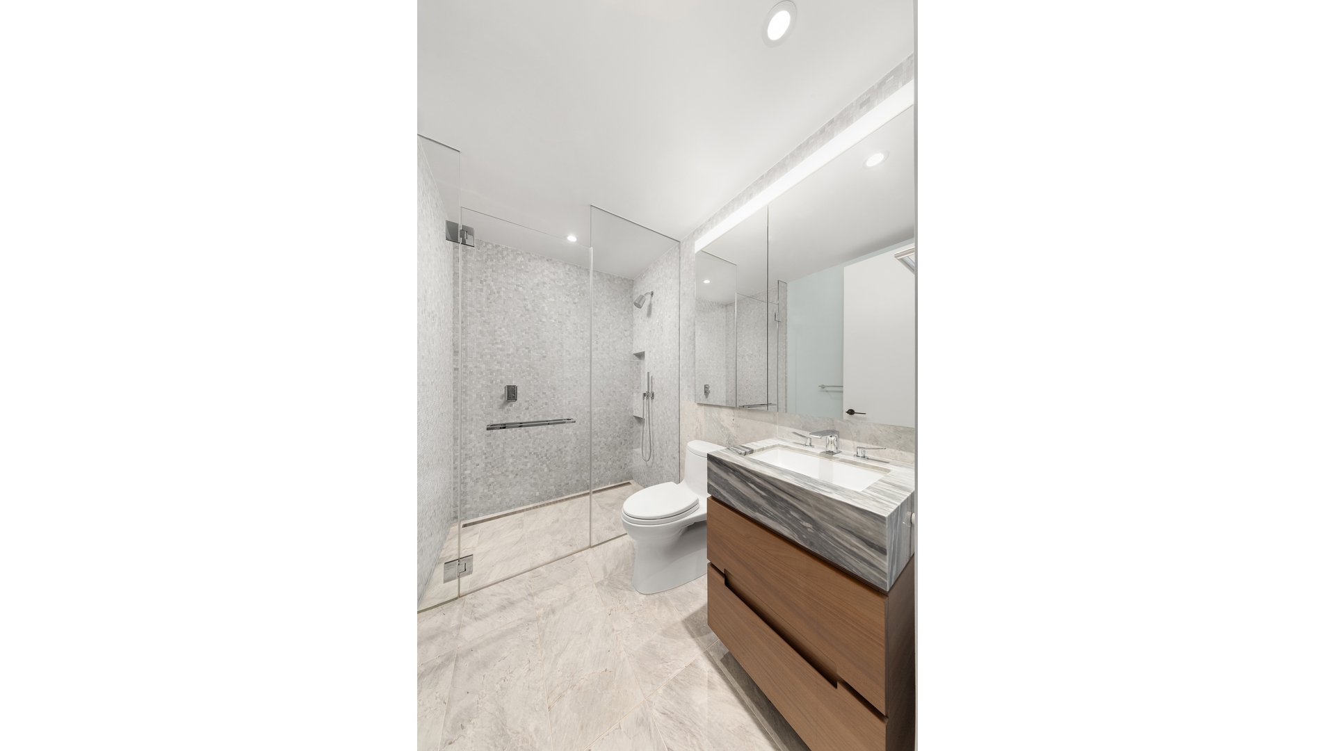 30 Riverside Boulevard, Unit 36B Manhattan, NY 10069 - Photo 8 of 27 a bathroom with a double vanity sink a toilet and a tub