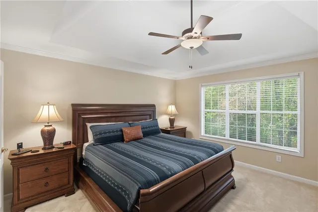 a bedroom with a bed and window