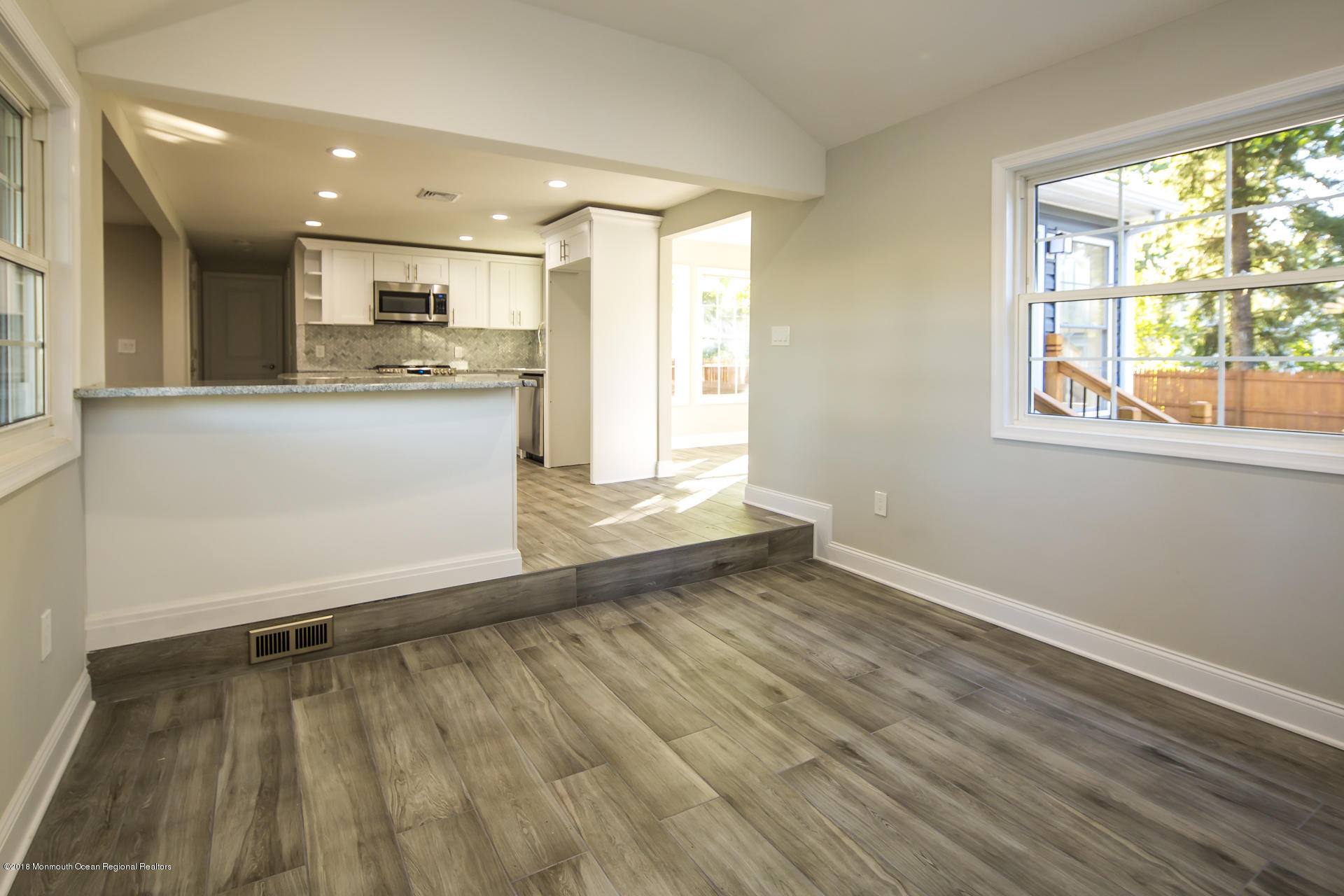 584 Colts Neck Road Freehold, NJ 07728 - Photo 14 of 29 a view of kitchen with wooden floor and electronic appliances