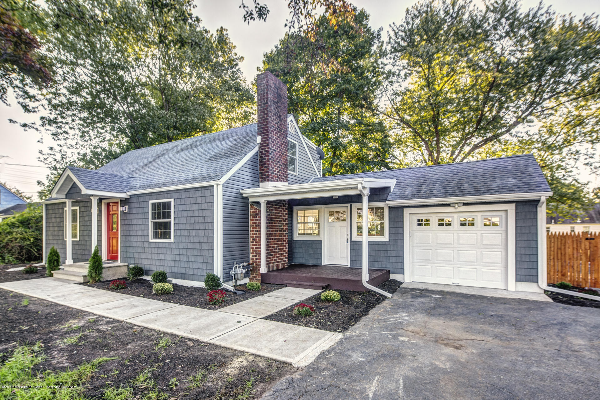 584 Colts Neck Road Freehold, NJ 07728 - Photo 2 of 29 a view of a house with a yard plants and large tree