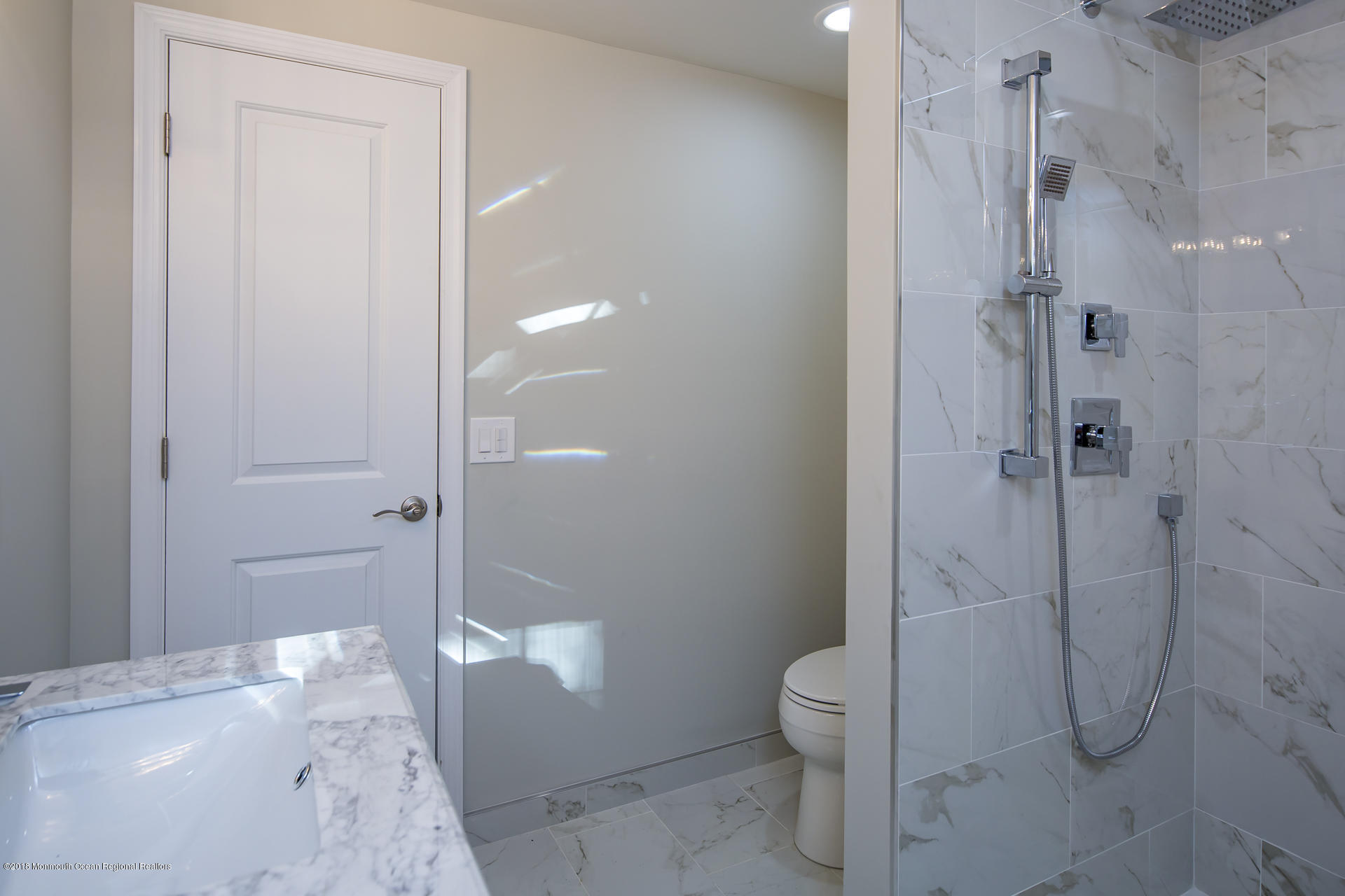 584 Colts Neck Road Freehold, NJ 07728 - Photo 21 of 29 a bathroom with a granite countertop shower and toilet