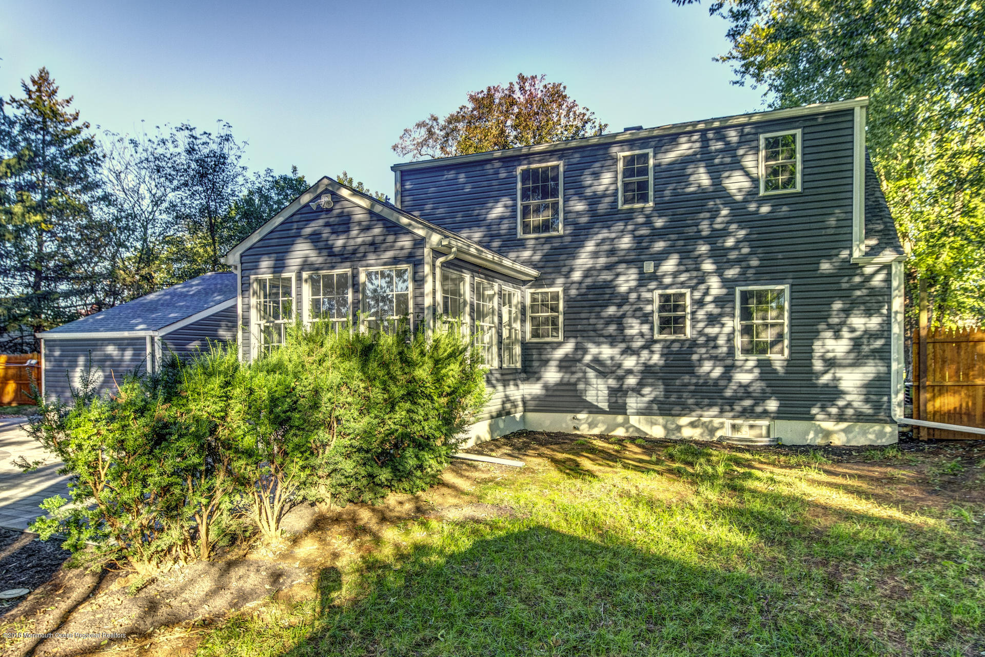 584 Colts Neck Road Freehold, NJ 07728 - Photo 23 of 29 a view of a house with yard and sitting area