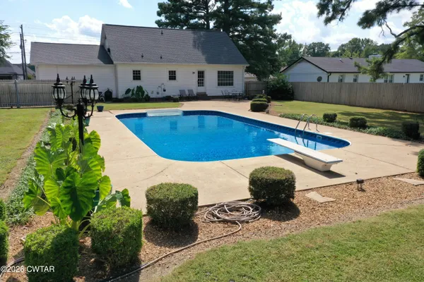 a view of a swimming pool with a patio