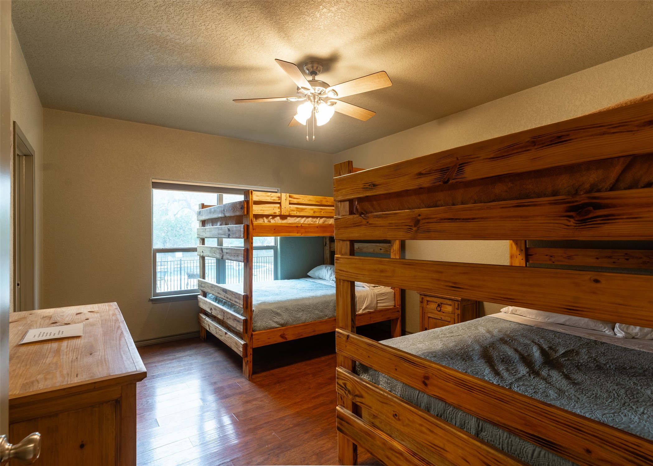 72 Stepping Stone Lane Concan, TX 78838 - Photo 16 of 25 a bedroom with furniture and window