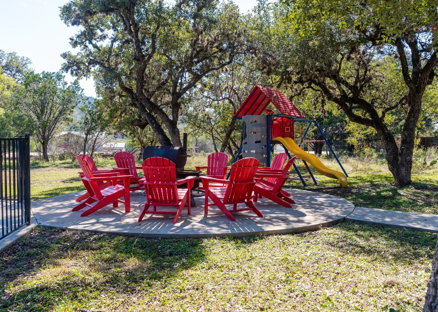 72 Stepping Stone Lane Concan, TX 78838 - Photo 24 of 25 a view of swimming pool with red chairs