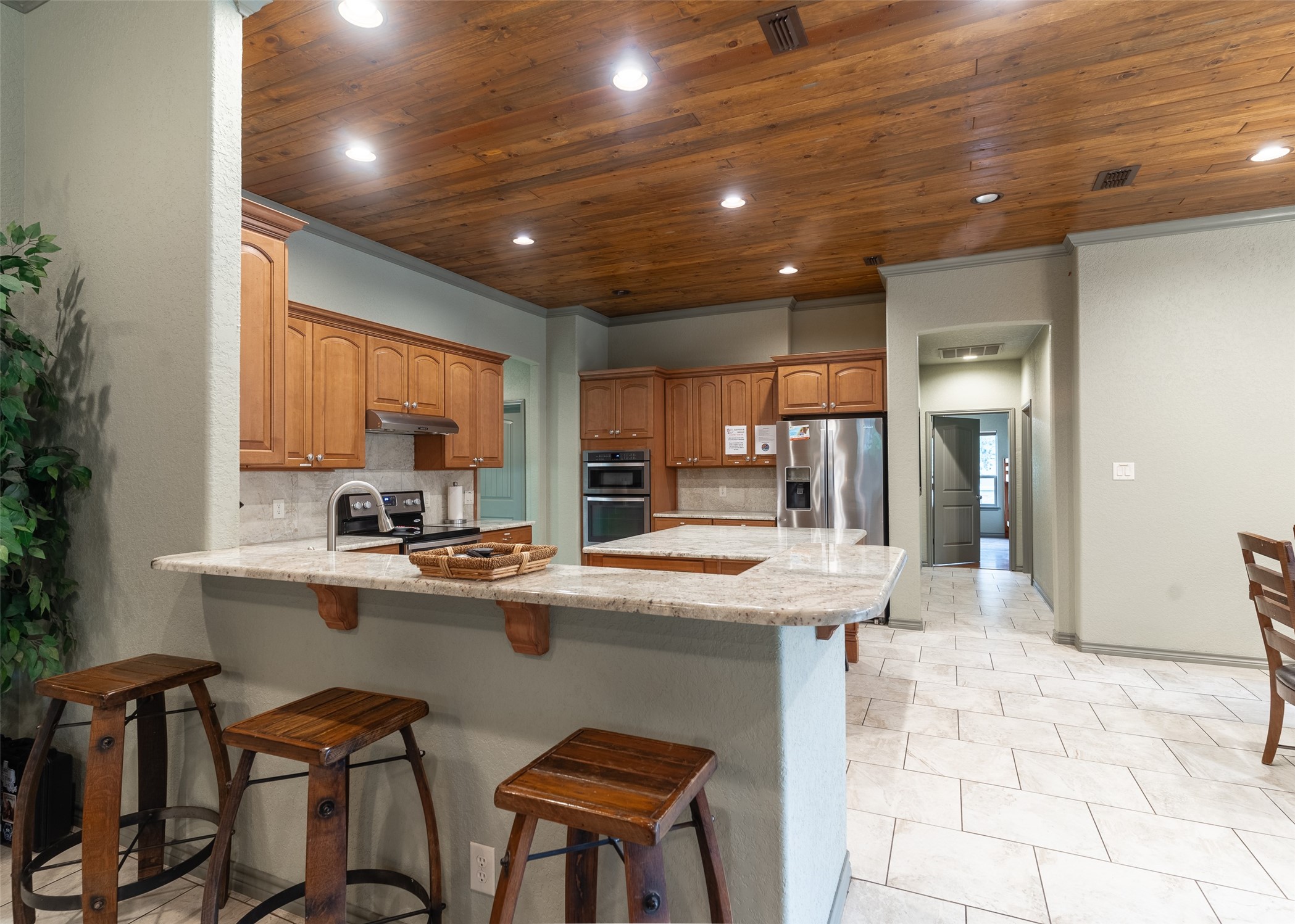 72 Stepping Stone Lane Concan, TX 78838 - Photo 10 of 25 a kitchen with stainless steel appliances granite countertop table chairs sink and cabinets