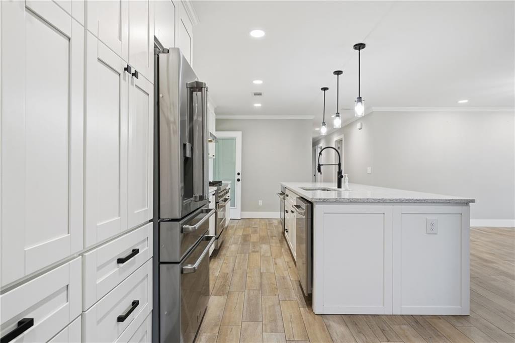1625 Lake Road Hiram, GA 30141 - Photo 13 of 58 a bathroom with a sink a mirror and a shower