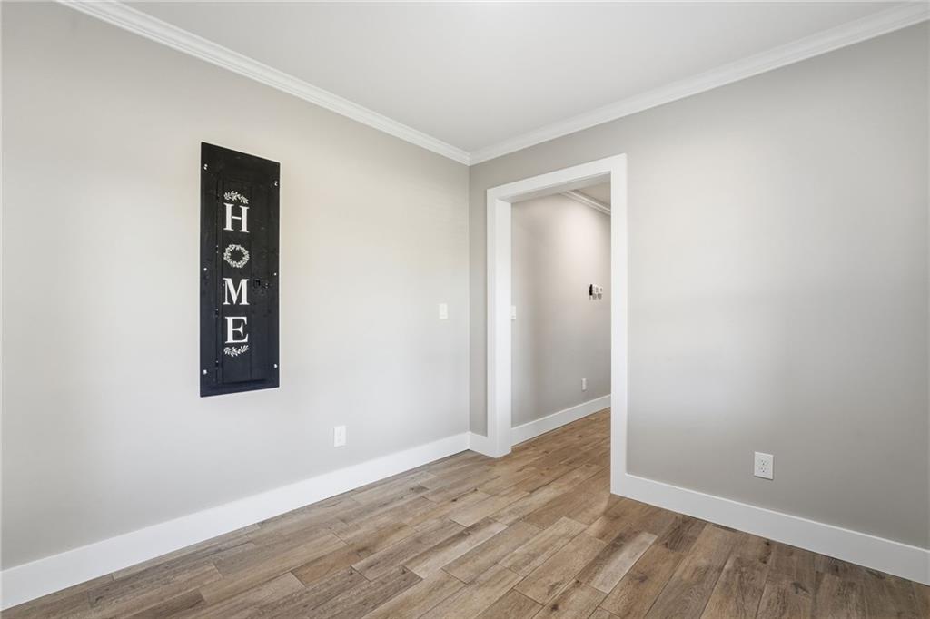 1625 Lake Road Hiram, GA 30141 - Photo 32 of 58 an empty room with wooden floor and closet