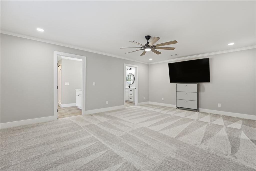 1625 Lake Road Hiram, GA 30141 - Photo 33 of 58 a view of an empty room with a chandelier fan and a window