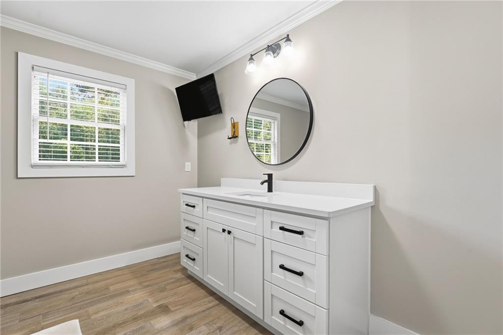 1625 Lake Road Hiram, GA 30141 - Photo 40 of 58 a bathroom with a sink and a mirror