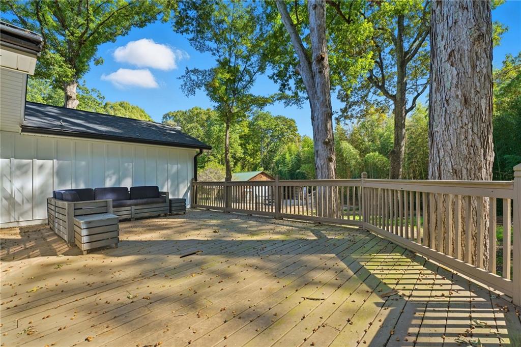 1625 Lake Road Hiram, GA 30141 - Photo 46 of 58 a view of backyard with wooden fence and a large tree