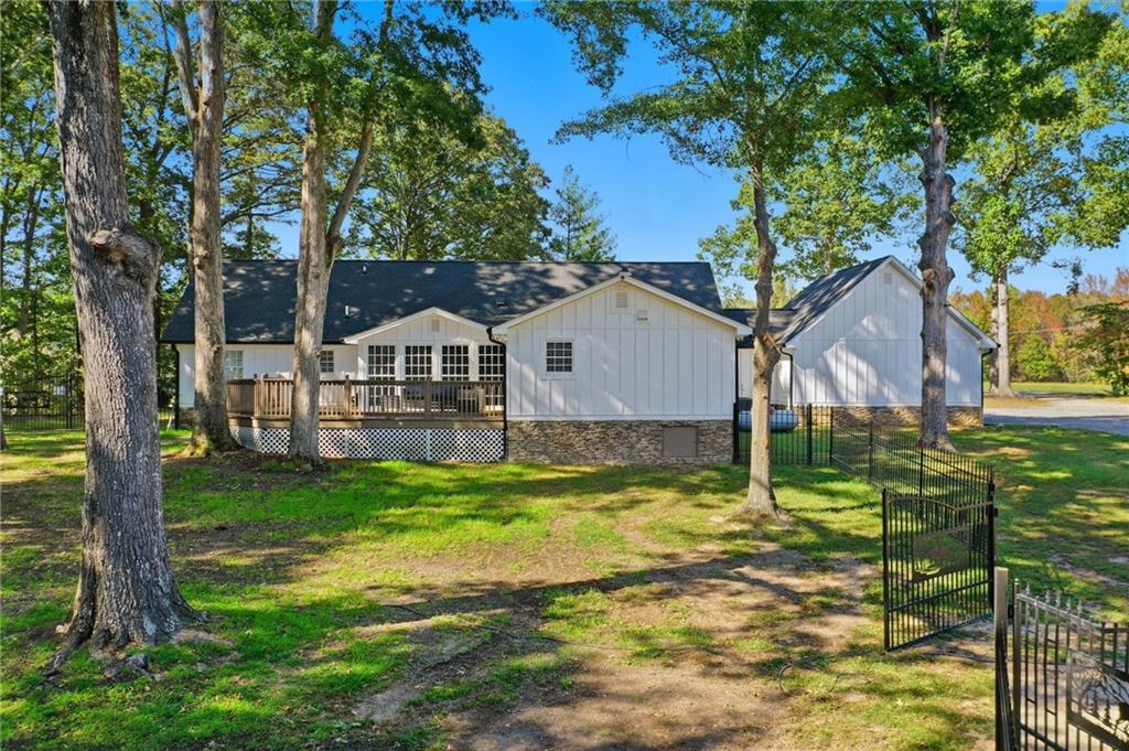 1625 Lake Road Hiram, GA 30141 - Photo 50 of 58 a view of a house with backyard and sitting area