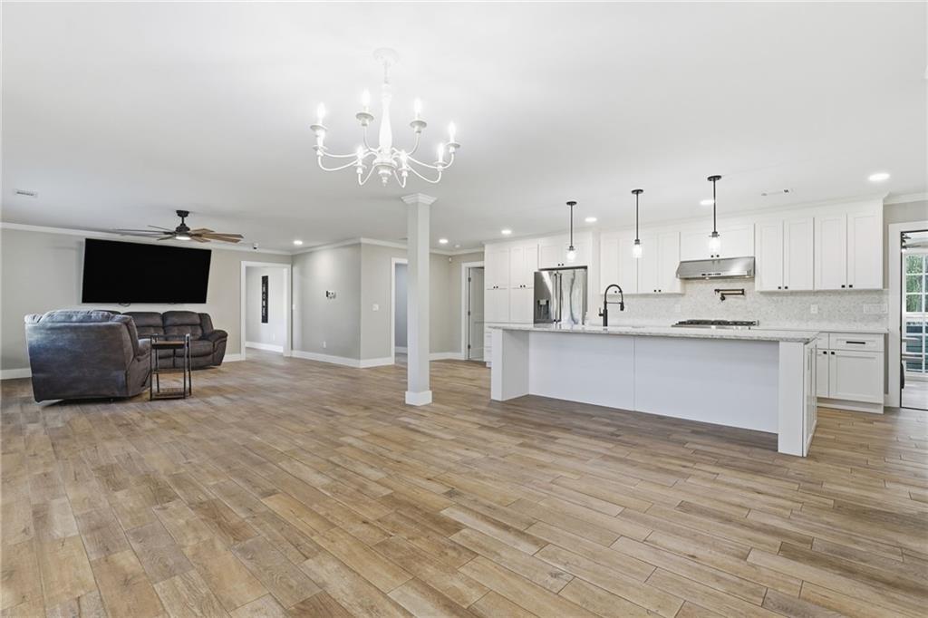 1625 Lake Road Hiram, GA 30141 - Photo 8 of 58 a large kitchen with kitchen island a sink stainless steel appliances and cabinets