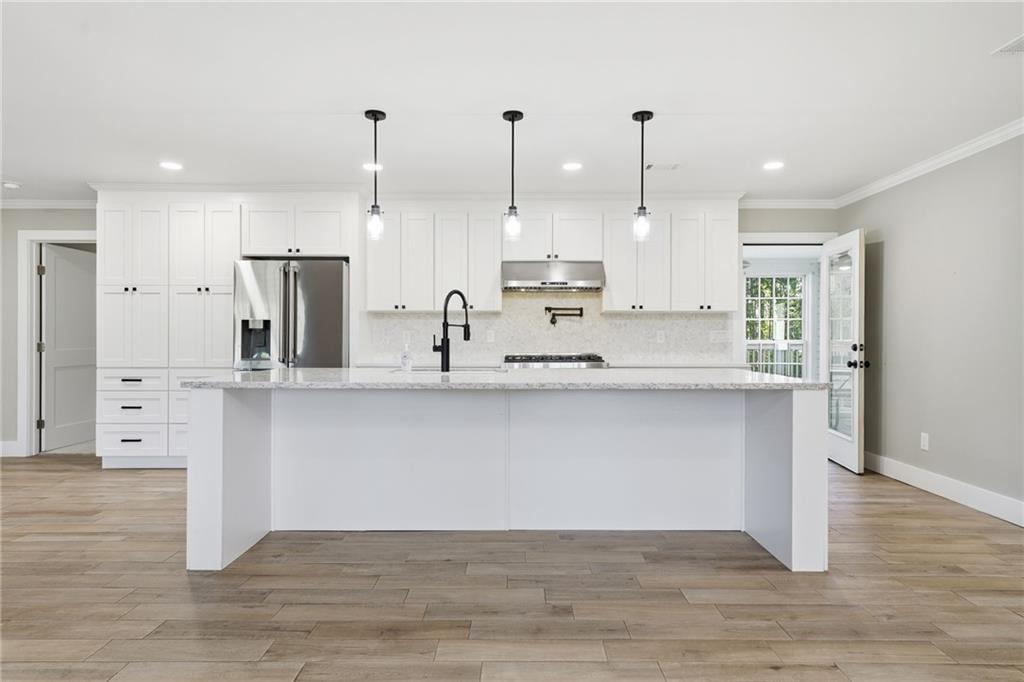 1625 Lake Road Hiram, GA 30141 - Photo 9 of 58 a view of kitchen with stainless steel appliances sink refrigerator and microwave