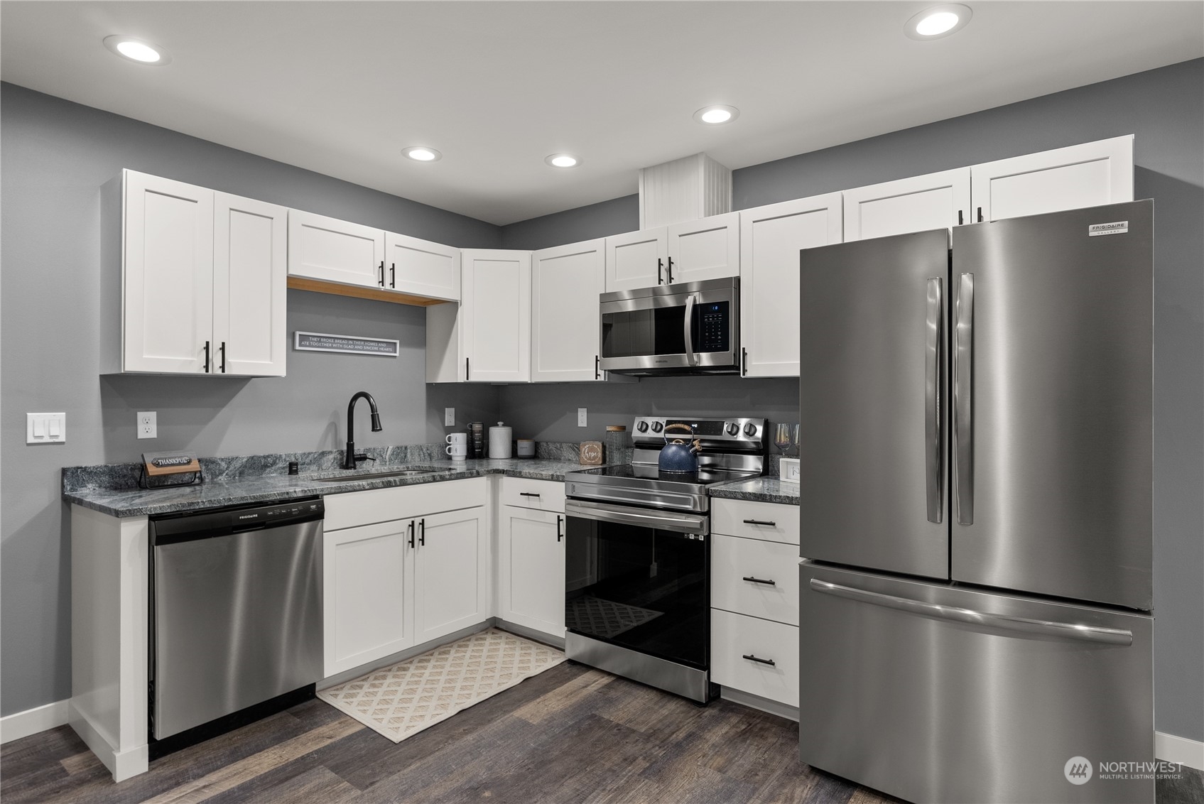 2915 Jackson Highway, Unit A Chehalis, WA 98532 - Photo 11 of 30 a kitchen with stainless steel appliances a refrigerator sink and cabinets