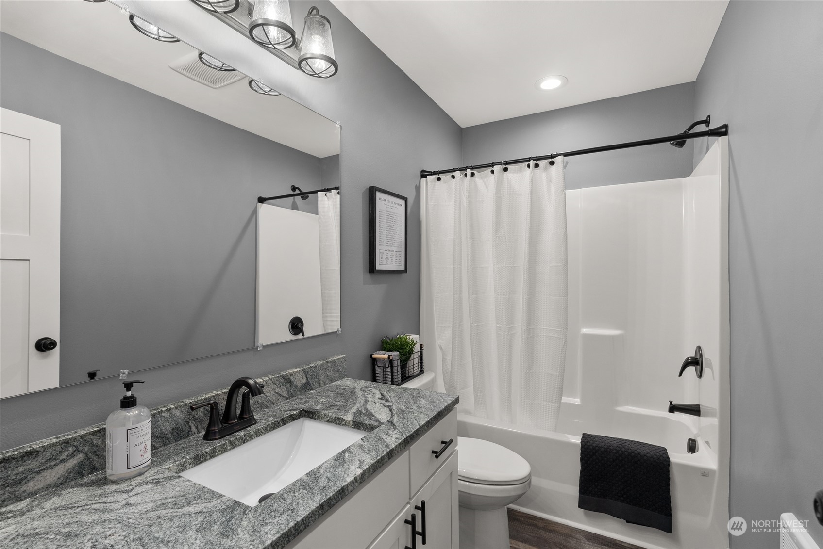 2915 Jackson Highway, Unit A Chehalis, WA 98532 - Photo 26 of 30 a bathroom with a granite countertop sink toilet and shower