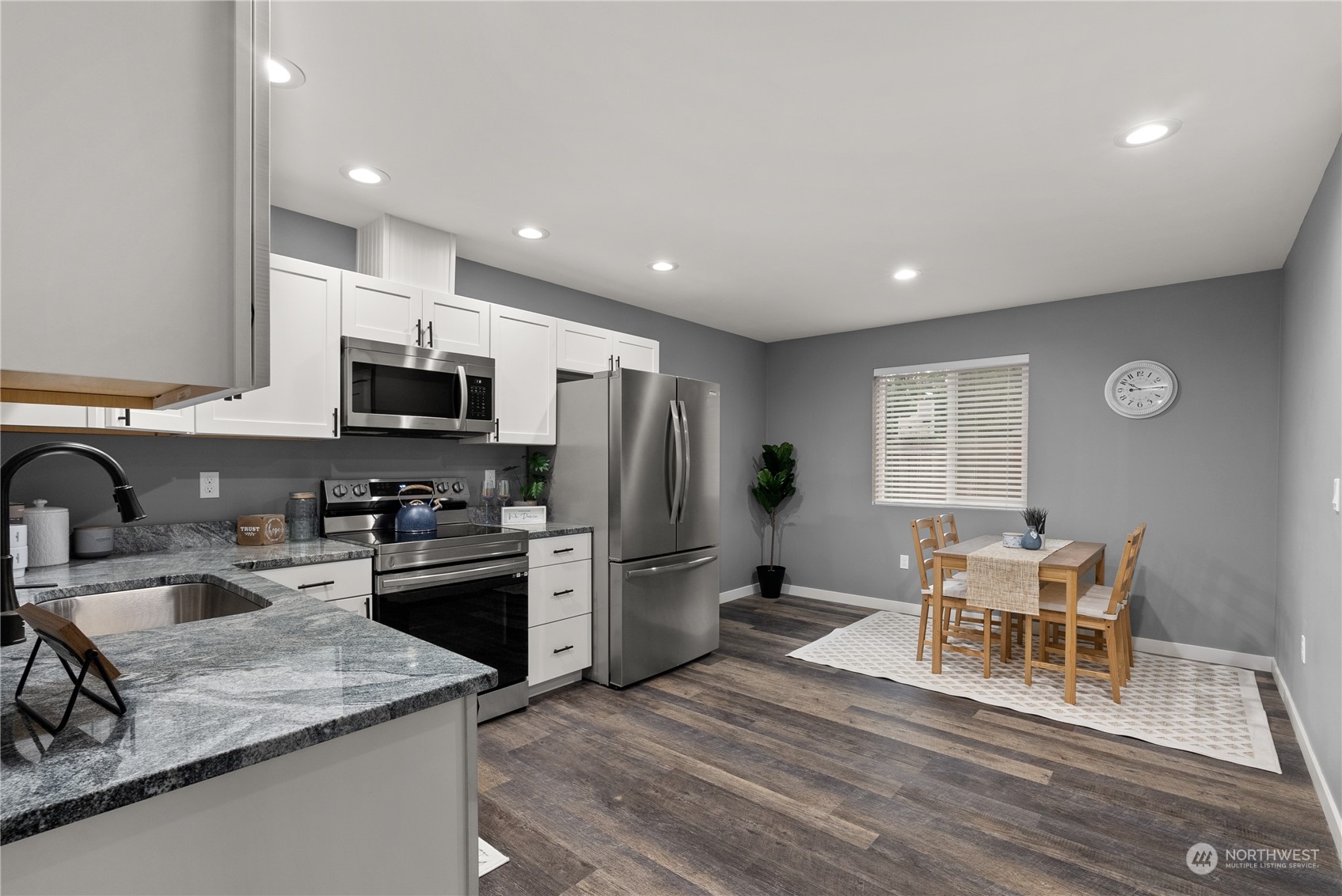 2915 Jackson Highway, Unit A Chehalis, WA 98532 - Photo 10 of 30 a kitchen with refrigerator and chairs