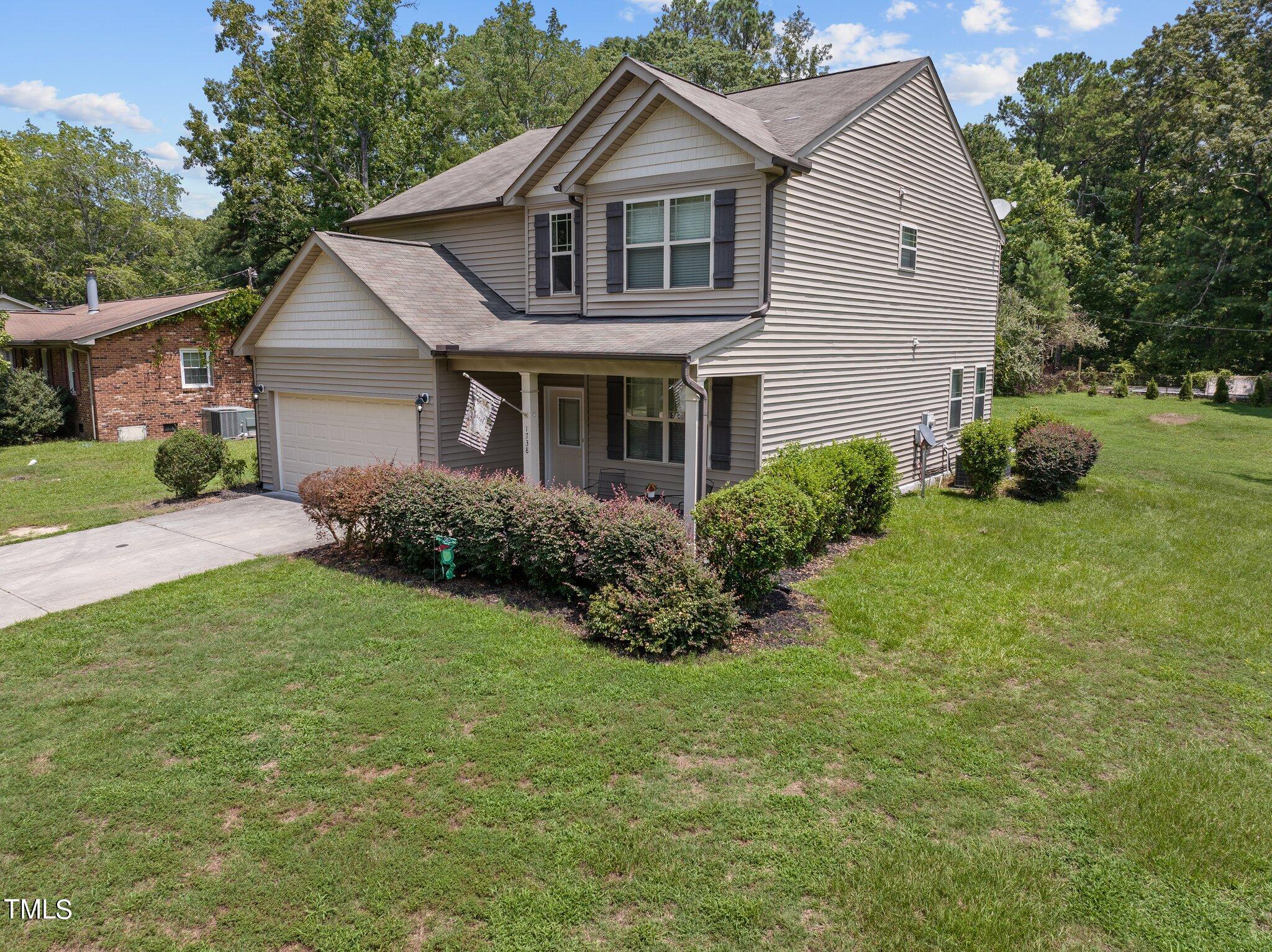 1738 Fletchers Chapel Road Durham, NC 27703 - Photo 2 of 60 49-web-or-mls-DJI_20240716130707_0381_D