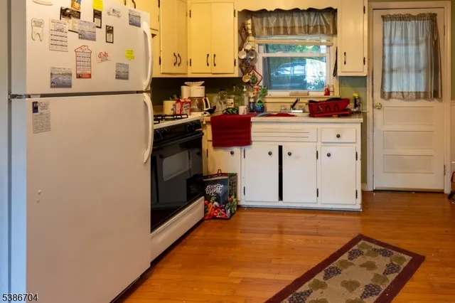 a kitchen with stainless steel appliances a refrigerator and a stove