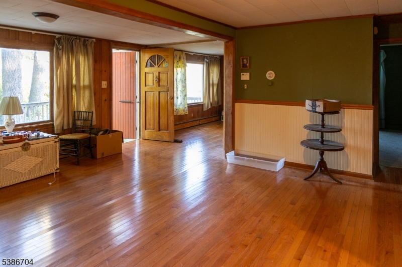 4 Lake Path 1 Road Branchville, NJ 07826 - Photo 2 of 16 a view of a livingroom with furniture hardwood floor and windows