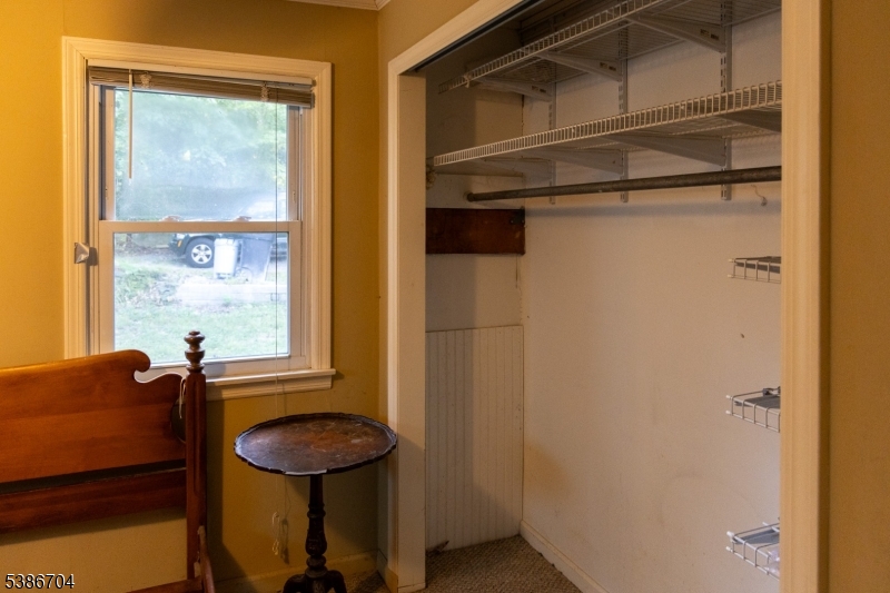 4 Lake Path 1 Road Branchville, NJ 07826 - Photo 7 of 16 a view of a room that has a bed and a window