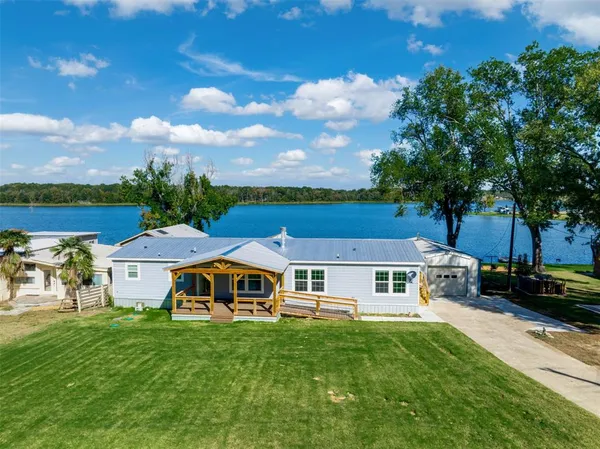 a aerial view of a house with a big yard