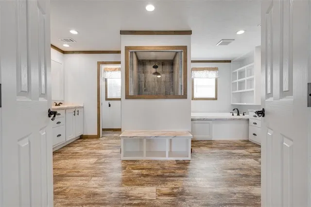 a living room with granite countertop furniture and a fireplace