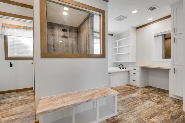 a room with a bed and cabinets