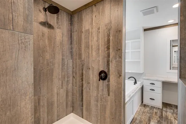 a bathroom with a shower curtain and a sink