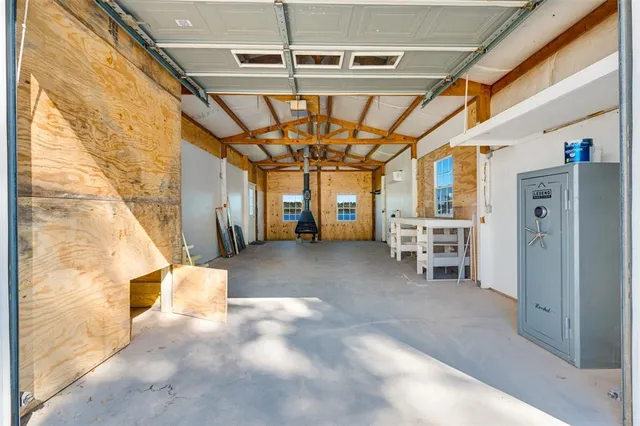 a view of a hallway with chairs