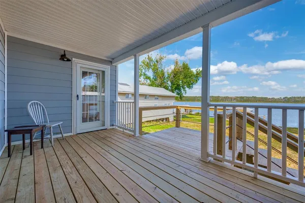 a view of sitting area with furniture and wooden floor